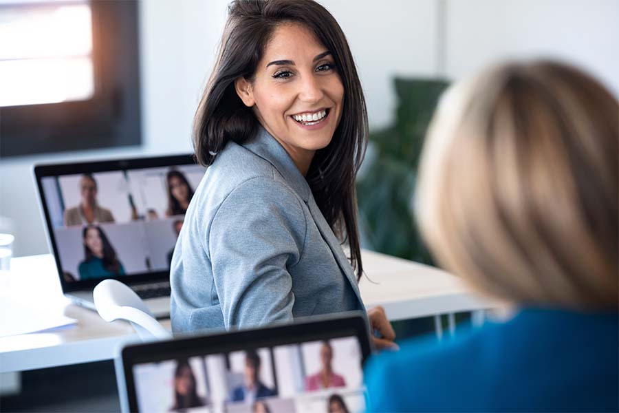 Woman talking to colleague at work